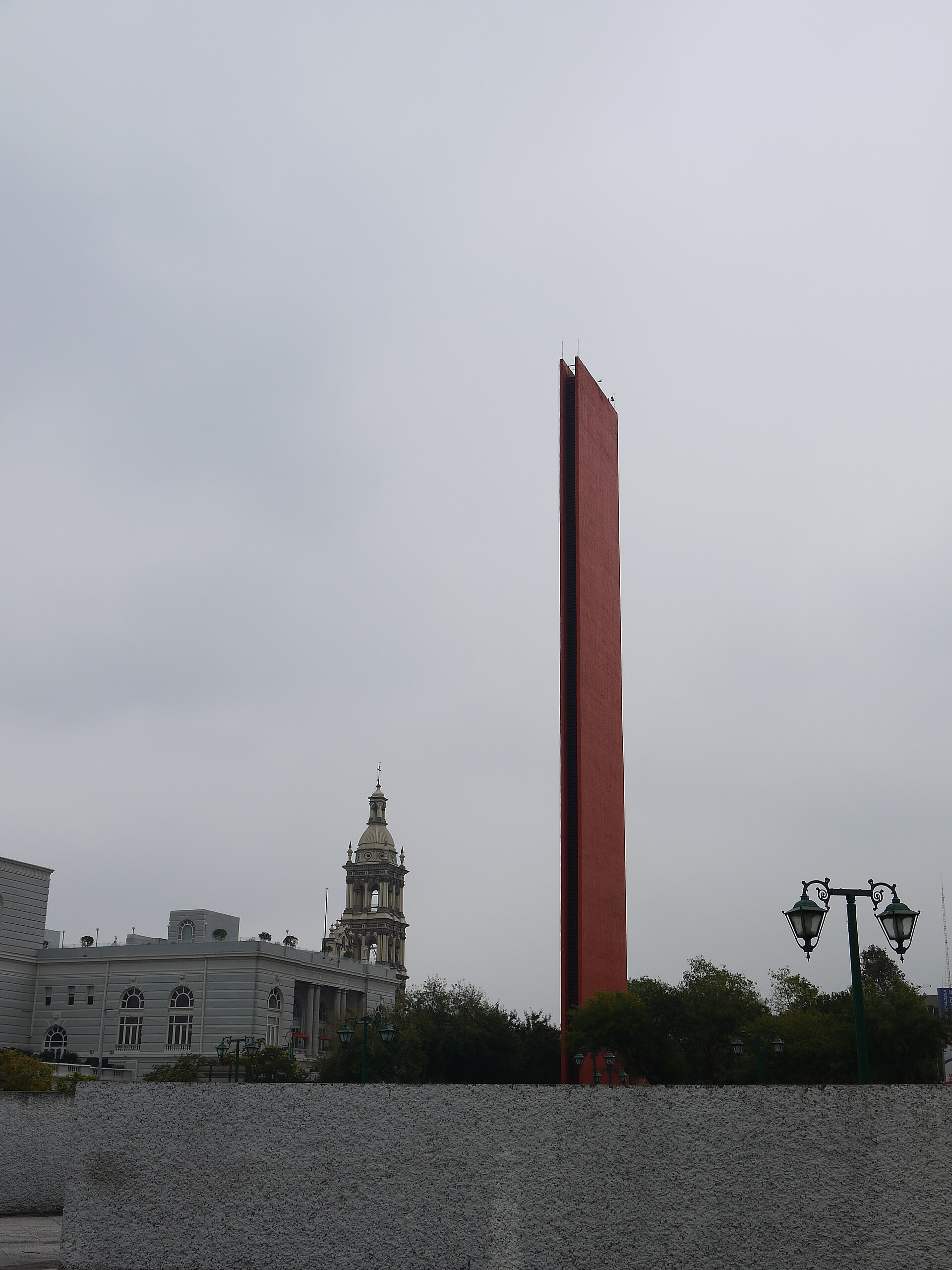 The Faro del Comercio, Luis Barragán's 70-meter slab of orange concrete, finished in 1984 for the centennial of the city's chamber of commerce.