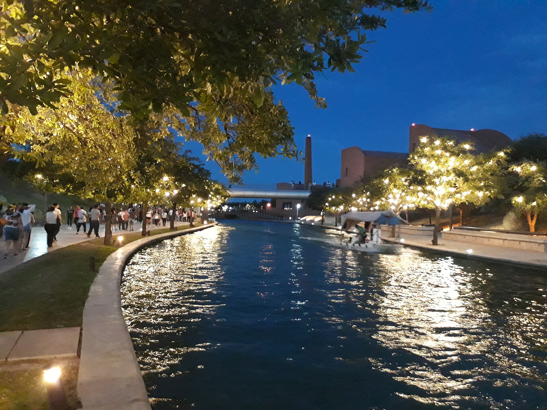 The Paseo Santa Lucía riverwalk at night